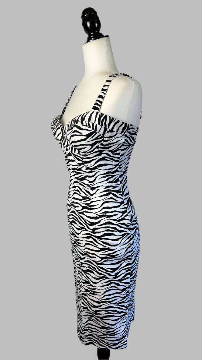 Zebra print dress on a mannequin against a white wall