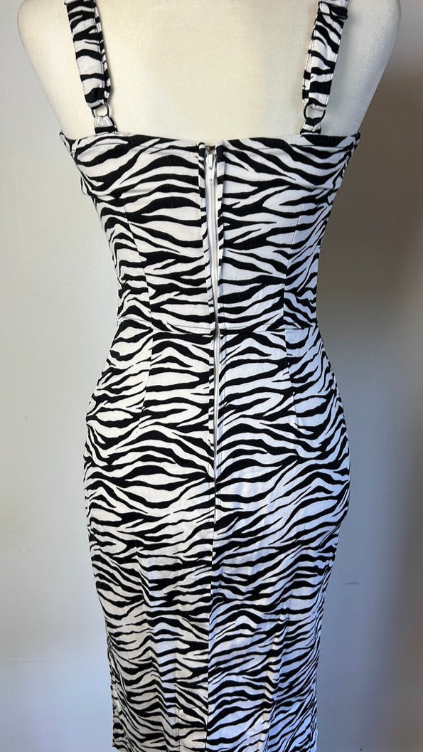 Zebra print dress on a mannequin against a white background